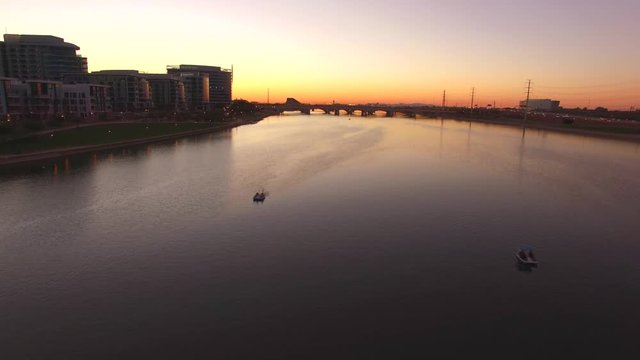 aerial drone footage of tempe town lake in arizona at sunset