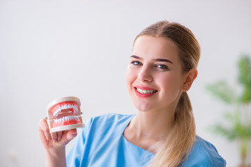 Young doctor nurse with dentures