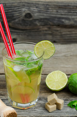 Mojito drink on wooden rustic background. Mojito cocktail 