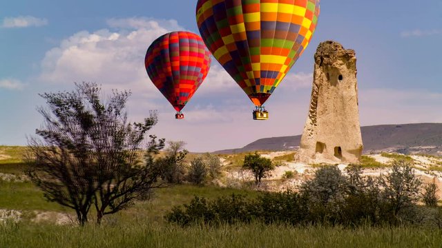 Cinemagraph of hot air balloons rising over a karst in Cappadocia, Turkey.