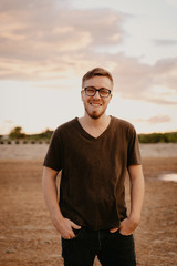 Handsome Young Male Model in Glasses and V-neck Modeling in Open Field Background