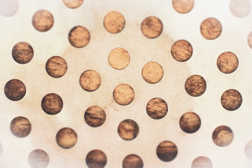 The metal drilled holes holes to make a background.