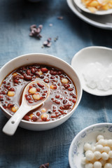 a bowl of sweet red bean soup with mini tang yuan