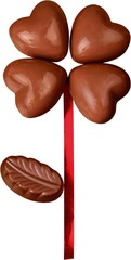 Close up of chocolate heart shape candies with red ribbon