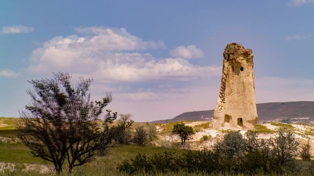Cinemagraph of a karst in Cappadocia Turkey with the motion of the clouds and trees.