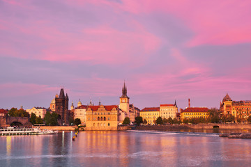 Prague, riverside on sunset with reflection
