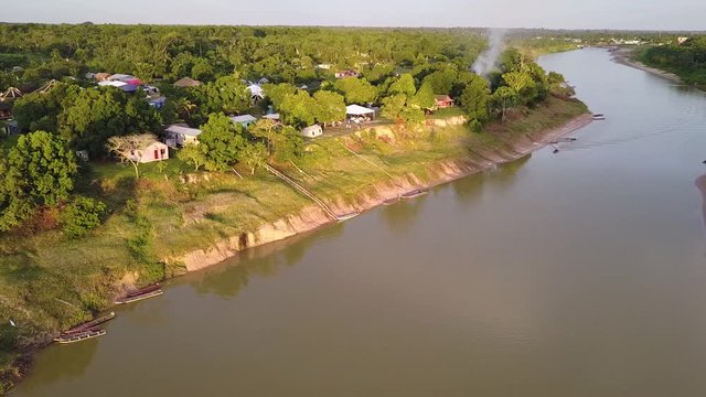 Aerial view of a Brazillian village Nova Morada in the state of Acre, boats at the bank of the Envira river