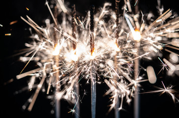 Fireworks , sparklers ,bursting against a black background