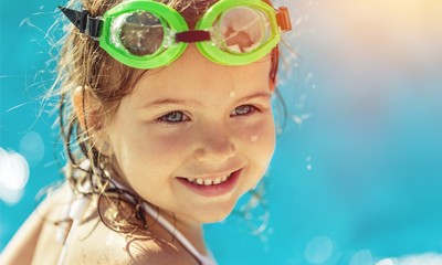 Beautiful little girl sunning at the pool