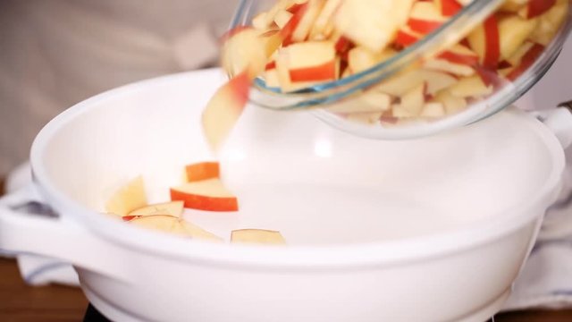 Step by step. Frying red apples with brown sugar for filling to make empanadas