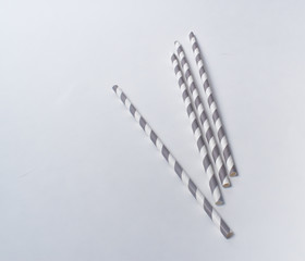 Gray and White Paper Straws on a White Background