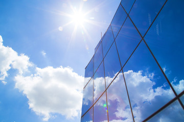 Building against the sky with shining rays - Powered by Adobe