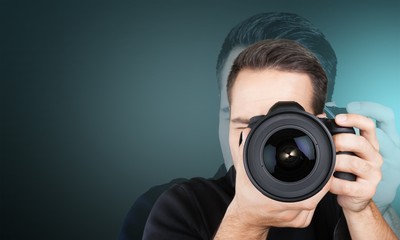 Male Photographer with Camera on black background