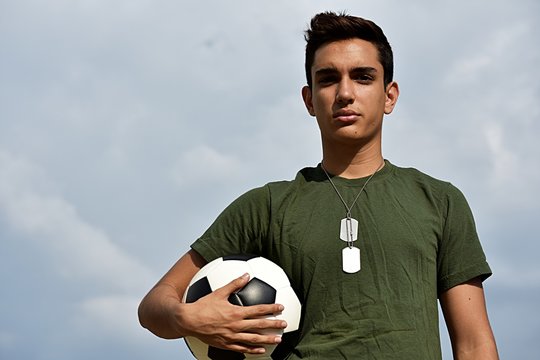 Athletic Hispanic Male Teen Soldier Posing