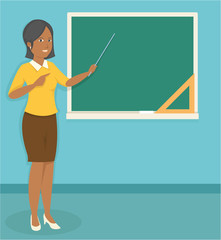 young black female teacher teaching in front of the classroom