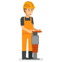 construction worker drilling the street surface to create a man hole