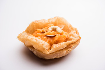 Suji/Sooji Halwa Puri or Shira Poori breakfast, served in a plate and bowl. selective focus