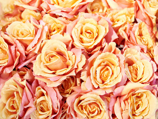 Background pink yellow rose artificial flowers