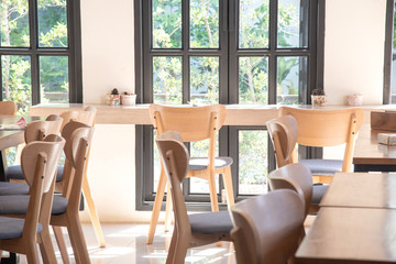 Table and chair by the window in the cafe for lunch.