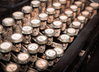 Close up of vintage fashioned typewriting machine. Conceptual image  publishing, blogging, author or writing.