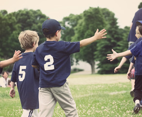 High Five line after a childs tee ball game