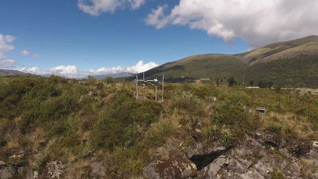 Aerial shot of a solar powered monitoring station at the active Cotopaxi Volcano, Ecuador. The camera is pointing at the Rio Pita Valley to give early warning of lahars (debris flows).