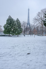 Eiffel tower under the snow in winter in Paris