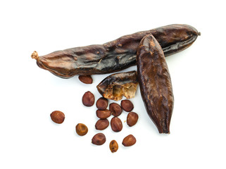 Carob on white background. Carob pods and seeds