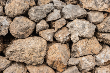 Seamless ashlar old Orange stone wall texture background. Horizontal