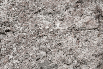 stone texture or background. Scabrous gray natural stone texture