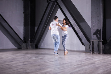 Obraz na płótnie Canvas Latino dancers enjoying their passion. Beautiful style of kizomba poses. Elegance moves.