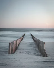 Fotobehang Calm sunset over beach in Netherlands © Peter Nolten