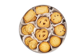 An overhead photo of Danish butter cookies in the traditional tin box, isolated on a white background with a clipping path