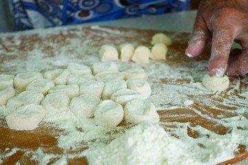 Home-made recipe for dumplings (raviol)i. Traditionally, women of the older generation mold the dumplings in the family.