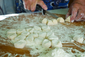 Home-made recipe for dumplings (raviol)i. Traditionally, women of the older generation mold the dumplings in the family.