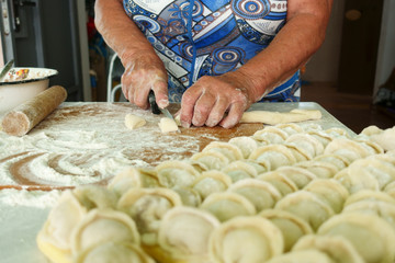 Home-made recipe for dumplings (raviol)i. Traditionally, women of the older generation mold the dumplings in the family.