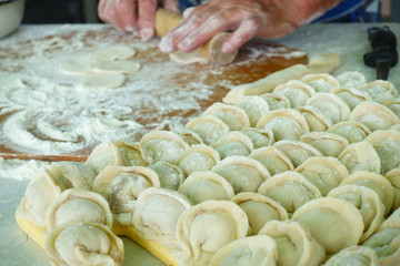 Home-made recipe for dumplings (raviol)i. Traditionally, women of the older generation mold the dumplings in the family.