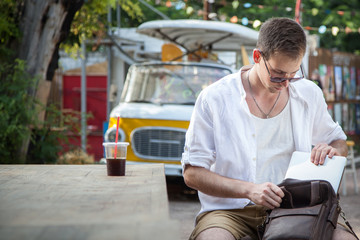  Cute student businessman  joyful and happy in the cafe in the park.