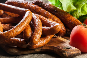 Assorted smoked sausages on a cutting board