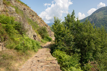 Naklejka na ściany i meble Road through the mountain in the valley of aran