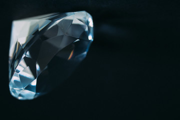 Diamond elements close-up on a black background. Abstraction. Defocused.