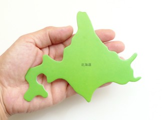 hand holding map of Hokkaido island in Japan with and Japanese Character wrote as the meaning of...