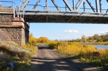 A train bridge support on the riverside