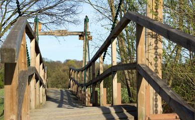 Naklejka premium Wooden footbridge over the river