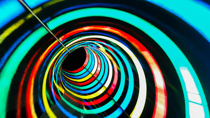Water colored attraction slide inside the colorful pipe