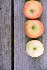 apples on a wooden background, a bench