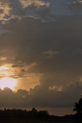 cumulus clouds at sunset