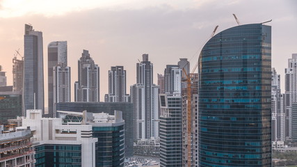 Fototapeta premium Dubai business bay towers at sunset aerial timelapse.