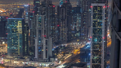 Dubai Downtown night timelapse modern towers view from the top in Dubai, United Arab Emirates.