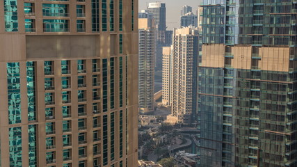 Fototapeta na wymiar Dubai skyline with skyscrapers timelapse at Dubai Marina from above.